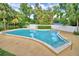 Take a refreshing dip in this community pool, enhanced with easy access stairs and a calming blue water under a sunny sky at 200 El Camino Dr # 206, Winter Haven, FL 33884