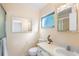 Well-lit bathroom with shower and tub, featuring a granite vanity top and decorative mirror at 205 Kilmer Ln, Winter Haven, FL 33884