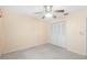 Comfortable bedroom includes a ceiling fan and spacious closet space at 205 Kilmer Ln, Winter Haven, FL 33884