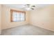 Cozy bedroom with a ceiling fan and natural light streaming in through a window at 205 Kilmer Ln, Winter Haven, FL 33884