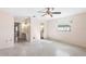 Bedroom featuring terrazzo floors, natural light, and a ceiling fan at 205 Kilmer Ln, Winter Haven, FL 33884