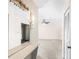 Hallway featuring terrazzo floors and access to other rooms in the house at 205 Kilmer Ln, Winter Haven, FL 33884
