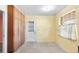Bright kitchen featuring wood cabinets, speckled flooring, and a built-in pantry space at 205 Kilmer Ln, Winter Haven, FL 33884