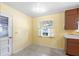 Sunny kitchen area with a view of the outdoors through a bright window and minimal appliances at 205 Kilmer Ln, Winter Haven, FL 33884