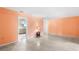 Inviting living room featuring terrazzo flooring and neutral paint at 205 Kilmer Ln, Winter Haven, FL 33884
