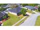 Offers an aerial view of a well-maintained home, green lawn, and landscaping in a residential neighborhood at 2110 Saddlewood Dr, Bartow, FL 33830