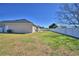 A large, fenced backyard offers ample space for outdoor enjoyment and recreation at 2110 Saddlewood Dr, Bartow, FL 33830