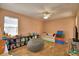 Spacious bedroom, ceiling fan, and plenty of room for activities at 2110 Saddlewood Dr, Bartow, FL 33830