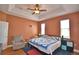 Comfortable bedroom with ceiling fan, windows, and furniture provides a restful space at 2110 Saddlewood Dr, Bartow, FL 33830