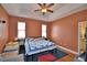 Spacious bedroom featuring trey ceilings, ceiling fan, and laminate flooring at 2110 Saddlewood Dr, Bartow, FL 33830