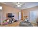 Spacious bedroom, ceiling fan, with a large door leading to the backyard at 2110 Saddlewood Dr, Bartow, FL 33830