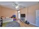 Spacious bedroom, ceiling fan, with a large door leading to the backyard at 2110 Saddlewood Dr, Bartow, FL 33830