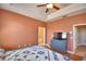 Spacious bedroom featuring trey ceilings, ceiling fan, and laminate flooring at 2110 Saddlewood Dr, Bartow, FL 33830