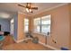 Bright dining area with tile floors, ceiling fan, and large windows for natural light at 2110 Saddlewood Dr, Bartow, FL 33830