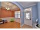 Bright entryway features tile flooring, stylish lighting, and a glimpse into the dining room at 2110 Saddlewood Dr, Bartow, FL 33830