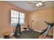 This exercise room features a large window and plenty of room for all your equipment at 2110 Saddlewood Dr, Bartow, FL 33830
