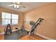 This exercise room features a large window and plenty of room for all your equipment at 2110 Saddlewood Dr, Bartow, FL 33830