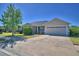 Lovely single-story home with a well-manicured lawn, neutral stucco exterior, and two-car garage at 2110 Saddlewood Dr, Bartow, FL 33830