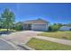 Charming single-story home boasts a well-maintained lawn and an attached two-car garage at 2110 Saddlewood Dr, Bartow, FL 33830