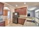 The kitchen features wood cabinets, modern appliances, and a pass-through to the living room at 2110 Saddlewood Dr, Bartow, FL 33830