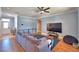 Spacious living room with modern decor, wood floors, and lots of natural light at 2110 Saddlewood Dr, Bartow, FL 33830