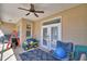 Covered patio featuring a ceiling fan, ample seating and backyard access, ideal for relaxation at 2110 Saddlewood Dr, Bartow, FL 33830