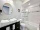 This bathroom boasts a modern vessel sink, decorative mirror, and tiled shower at 2204 Kettle Dr, Orlando, FL 32835
