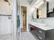 Bathroom with a tiled shower stall, dual sinks and vanities and modern fixtures at 2204 Kettle Dr, Orlando, FL 32835
