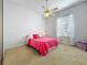 This bedroom features a ceiling fan, a window with curtains, and carpet floors at 2204 Kettle Dr, Orlando, FL 32835