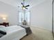 Bright bedroom with carpeted floors, a ceiling fan, and natural light from the windows at 2204 Kettle Dr, Orlando, FL 32835