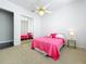 This bedroom features carpet floors, a ceiling fan, and mirrored closet doors at 2204 Kettle Dr, Orlando, FL 32835