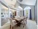 Light and airy dining room with high ceilings and a large arched window offering natural light at 2204 Kettle Dr, Orlando, FL 32835
