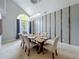 Elegant dining room with textured wallpaper, crystal chandelier, and seating for six at 2204 Kettle Dr, Orlando, FL 32835