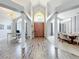 Grand foyer with hardwood floors and views to the open office and dining room at 2204 Kettle Dr, Orlando, FL 32835