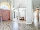 Inviting foyer with hardwood floors, and views to the dining and office areas at 2204 Kettle Dr, Orlando, FL 32835
