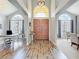 Elegant foyer with high ceilings, arched windows, and a grand double-door entrance at 2204 Kettle Dr, Orlando, FL 32835