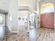 Well-lit foyer with hardwood floors and views to the office and other living spaces at 2204 Kettle Dr, Orlando, FL 32835