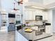 Open kitchen featuring granite countertops, stainless steel appliances, and a view into the living room at 2204 Kettle Dr, Orlando, FL 32835