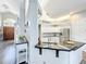 Modern kitchen features granite countertops, stainless steel appliances, and white cabinets, with an island and sink at 2204 Kettle Dr, Orlando, FL 32835