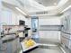 Stylish kitchen featuring granite countertops, stainless steel appliances, and white cabinets with modern fixtures at 2204 Kettle Dr, Orlando, FL 32835