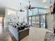 Living room featuring high ceilings and windows, and views to the pool at 2204 Kettle Dr, Orlando, FL 32835