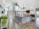 Spacious living room with a stone fireplace, high ceilings and large windows at 2204 Kettle Dr, Orlando, FL 32835