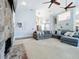 Living room showcasing a stone fireplace, high ceilings, and natural light at 2204 Kettle Dr, Orlando, FL 32835