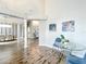 Open-concept living space with hardwood floors and views to the dining room and kitchen area at 2204 Kettle Dr, Orlando, FL 32835