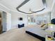 Bedroom showcasing tray ceilings, seating area, and access to both an en-suite bathroom and pool at 2204 Kettle Dr, Orlando, FL 32835
