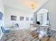 Office space featuring hardwood floors, a large arched window, and modern décor at 2204 Kettle Dr, Orlando, FL 32835
