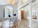 Home office with vaulted ceilings, a large arched window, and direct access to the dining area at 2204 Kettle Dr, Orlando, FL 32835