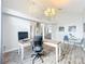 Open concept office features hard wood floors, and view to other living spaces at 2204 Kettle Dr, Orlando, FL 32835