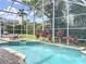 This beautiful pool is screen enclosed and surrounded by lush landscaping at 2204 Kettle Dr, Orlando, FL 32835
