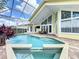 A beautiful screened-in pool and jacuzzi with stylish brick deck at 2204 Kettle Dr, Orlando, FL 32835